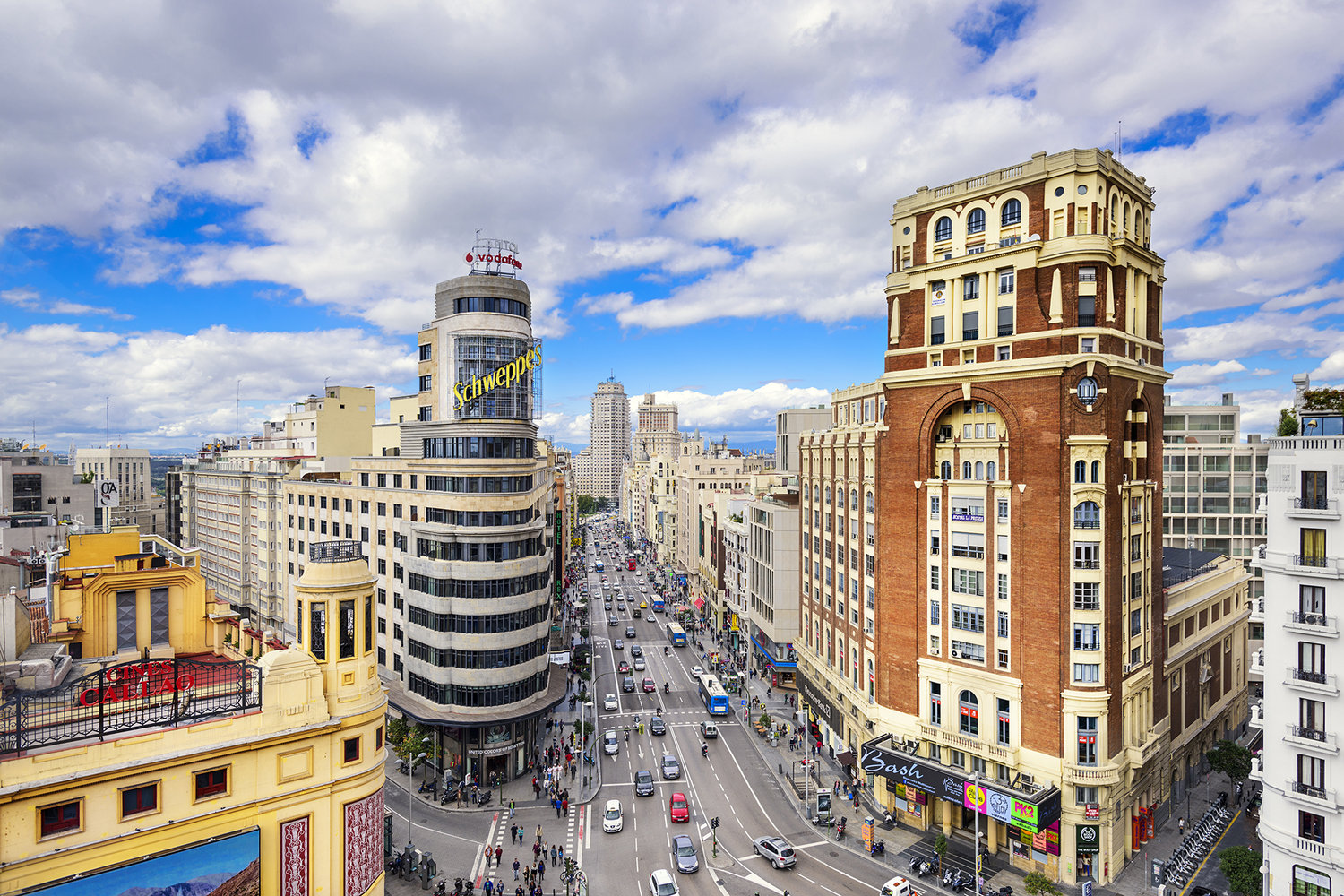 MADRID, SPAIN - OCTOBER 15, 2014: Gran Via at the Iconic Schweppes Building. The street is the main shopping district of Madrid.